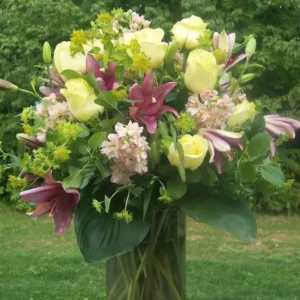large vase of pink and white flowers, which included stargazer lilies and while lisianthus.